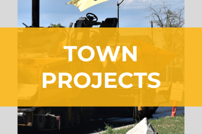 Image with construction equipment and "Town Projects" written across image