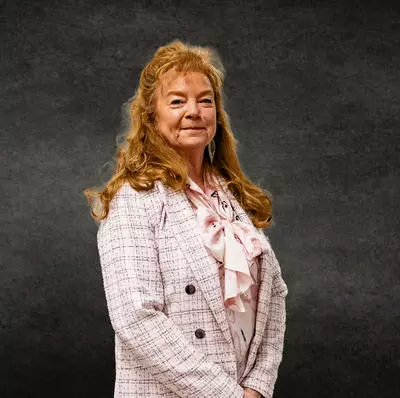image of Colleen Whitlow with grey background